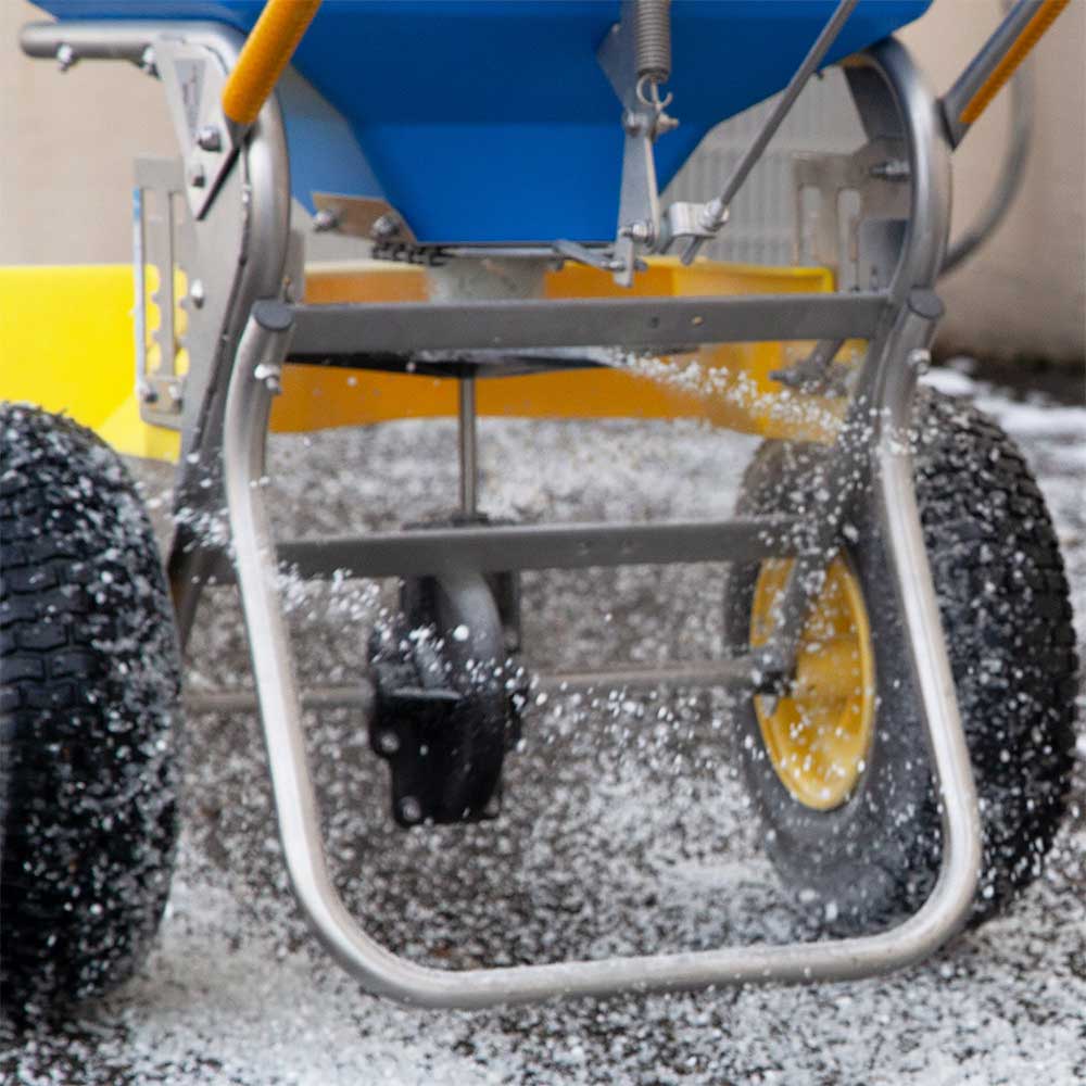 Spyker stainless steel push spreader identified for ice-melt applications with 100-pound capacity